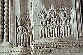 Angkor Wat temple, second enclosure, devatas sculpted in bas-relief with an extraordinary variety of intricate hair styles and costumes.